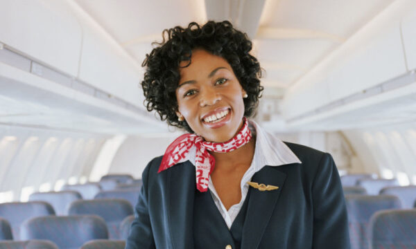 flight attendant smiling on plane