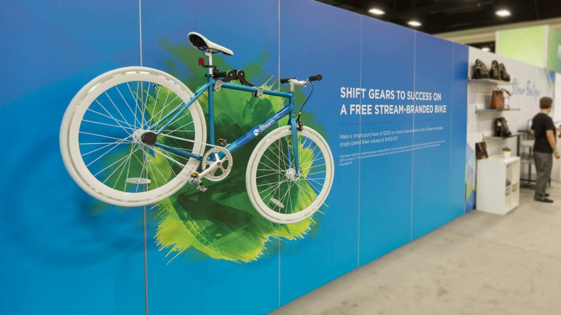bike hanging on wall of a trade show exhibit