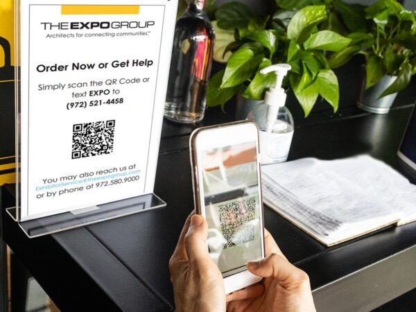 person scanning expo group's singleconnect support qr code at a trade show