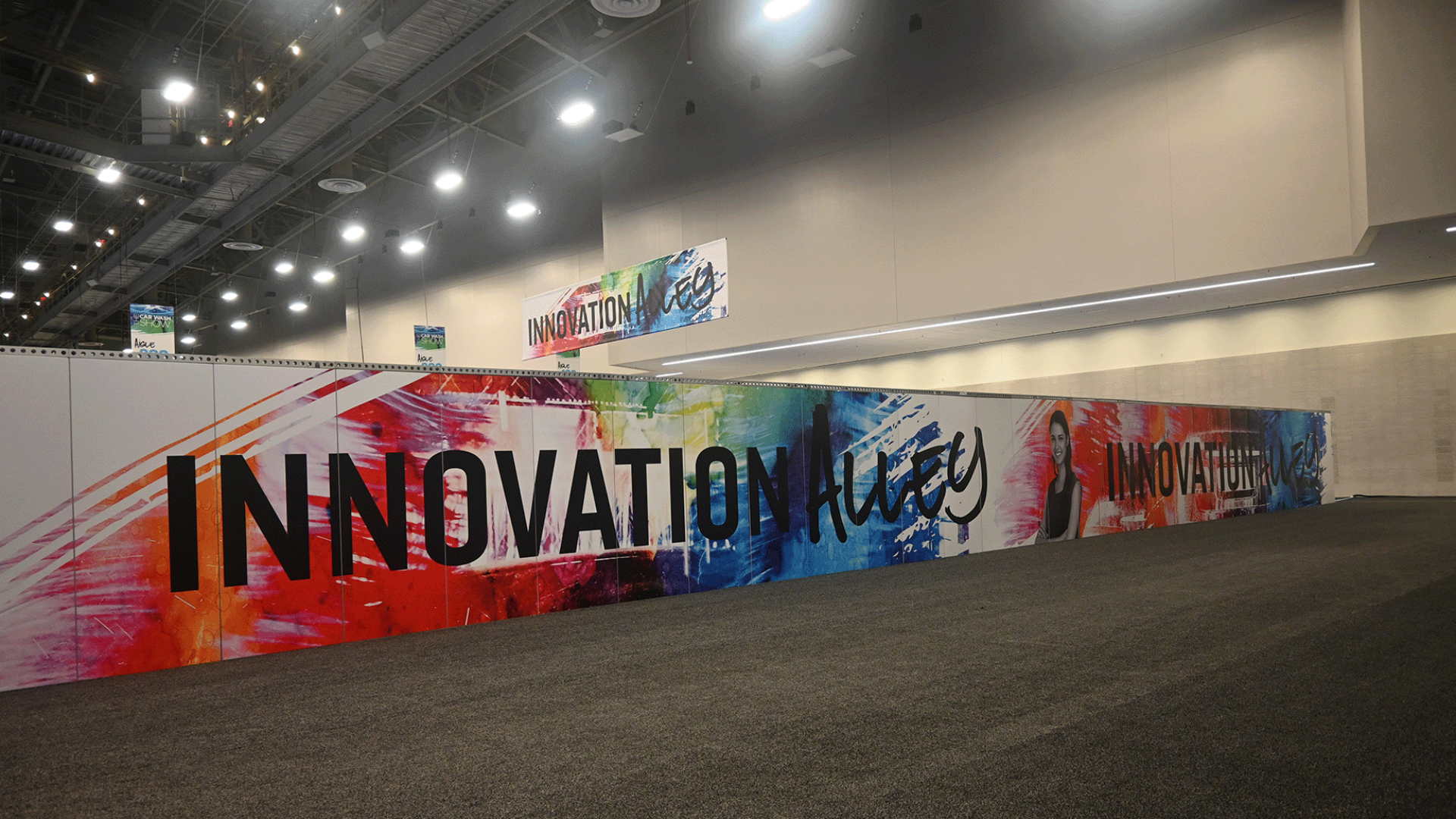 colorful spray painted wall that says innovation alley